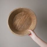 Raw wooden dish carved in the mass ethnic African art handmade artisanal manufacturing