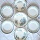 Mismatched antique flat plates made of ironstone accompanied by