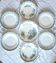 Mismatched antique flat plates made of ironstone accompanied by