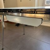 Blue Formica table for 4 to 6 people