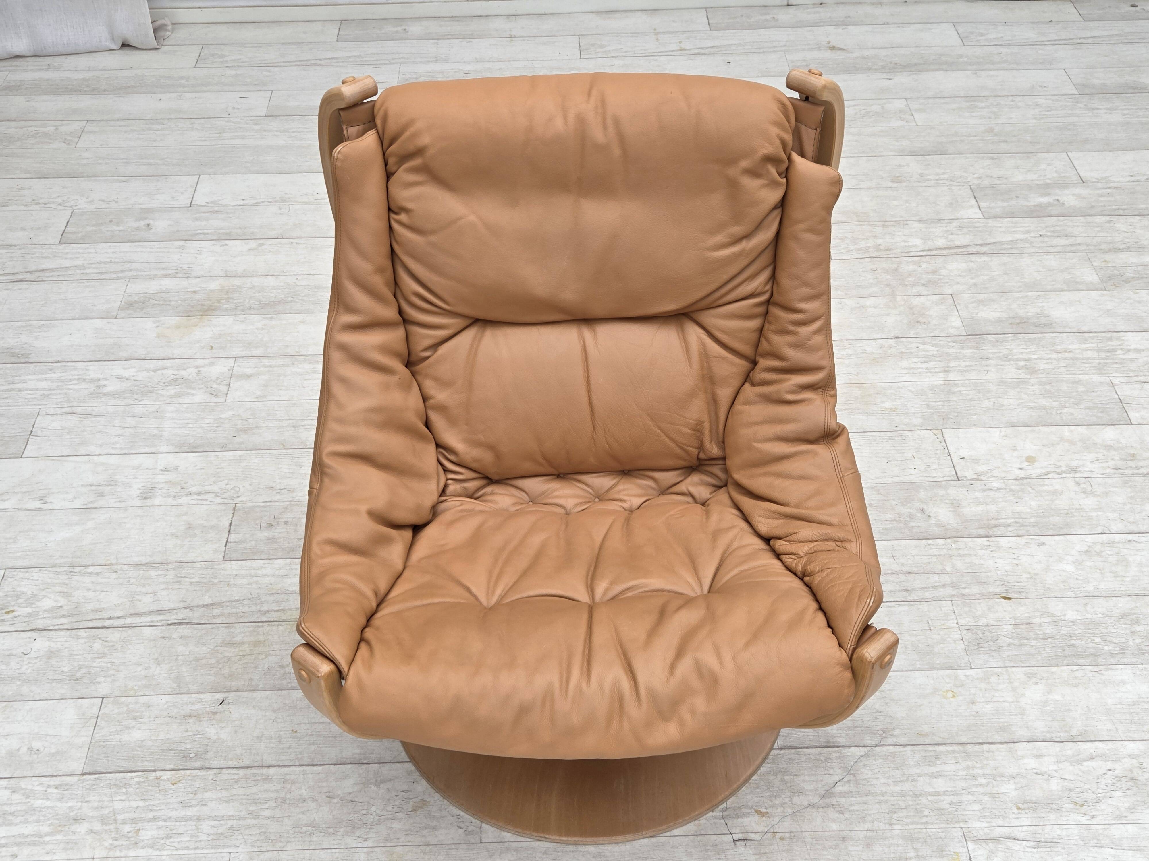 1980s, Scandinavian swivel armchair, furniture leather, bent wood.