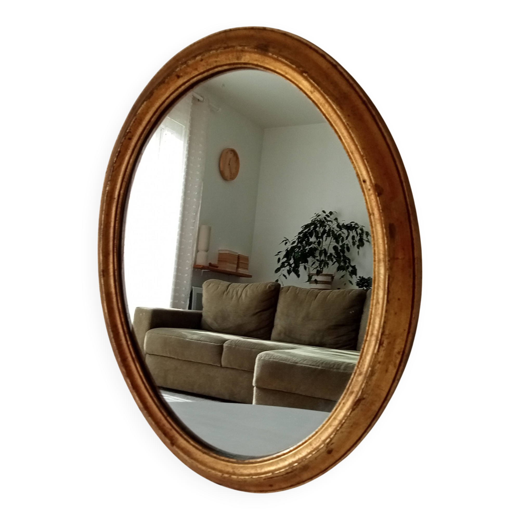 Antique oval mirror in gilded solid wood