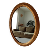 Antique oval mirror in gilded solid wood
