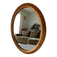 Antique oval mirror in gilded solid wood