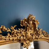 Antique mirror with pediments 141cm/80cm gilded with gold leaf, beveled ice