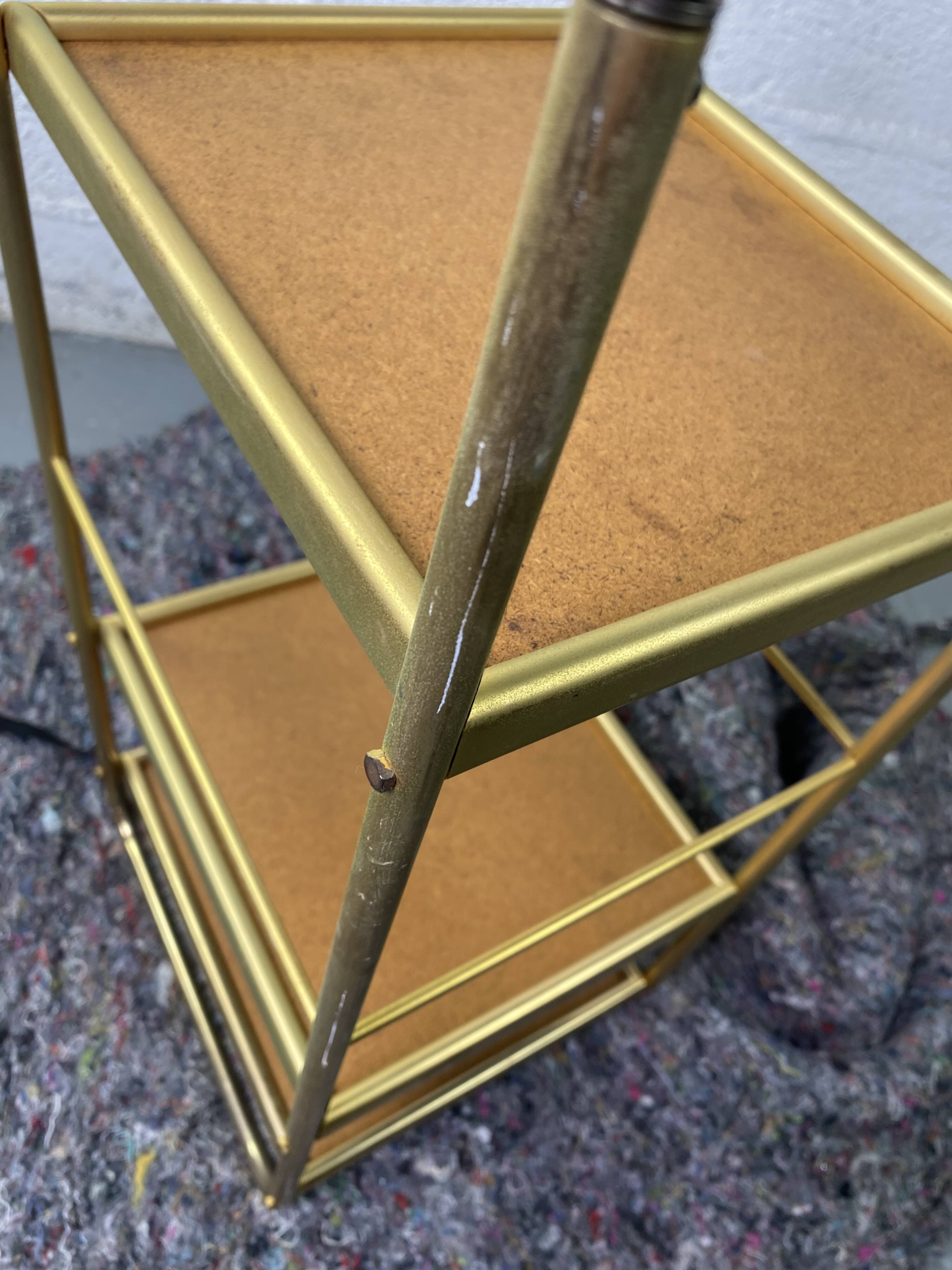 Small rolling trolley in brass and black plastic