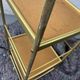 Small rolling trolley in brass and black plastic