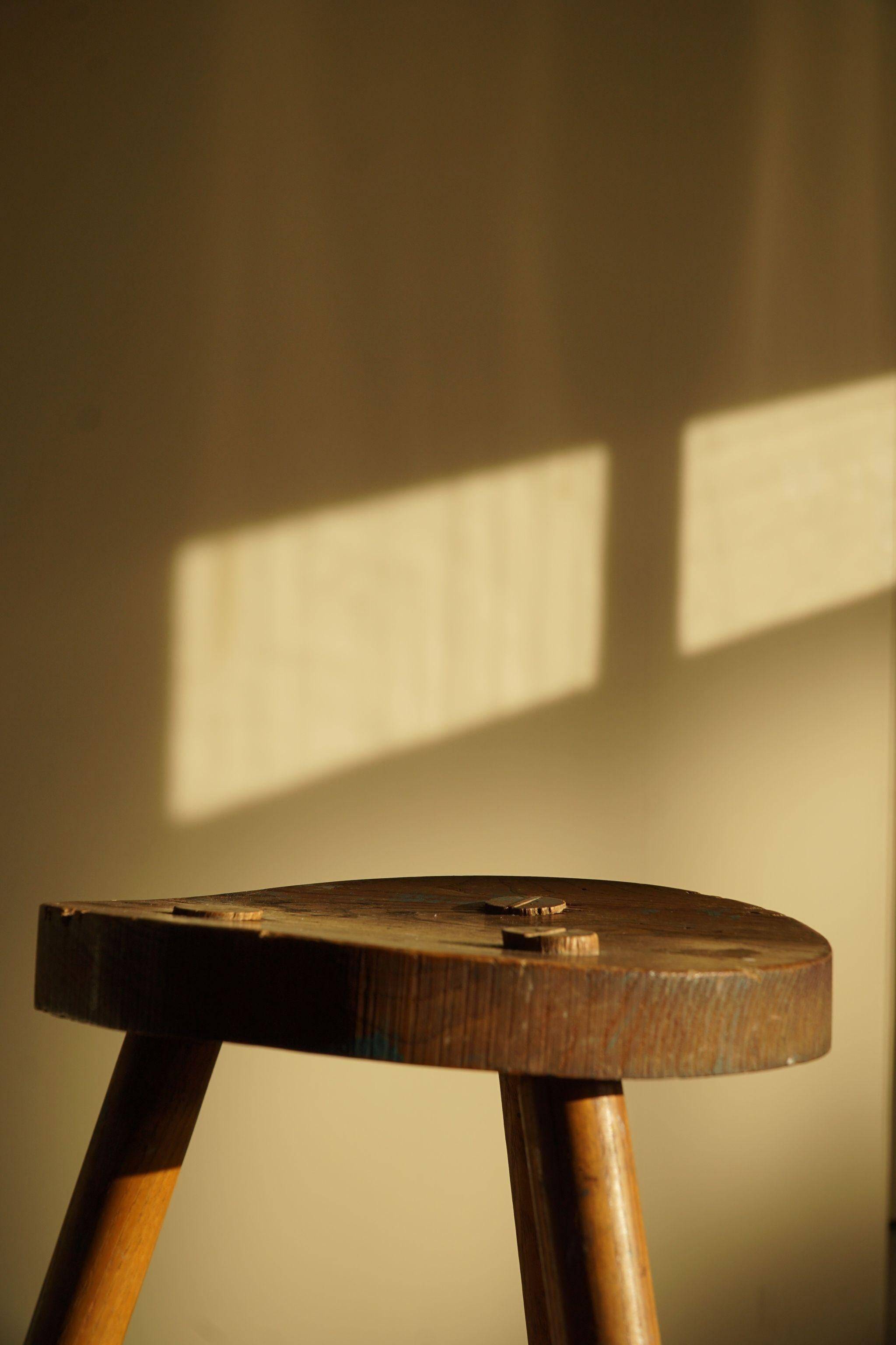 Tripod stool made of solid oak, by a Danish cabinetmaker, mid-century, around 1960.