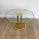 Designer coffee table in brass and glass