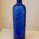 Vintage decanter bottle made of blue molded pressed glass