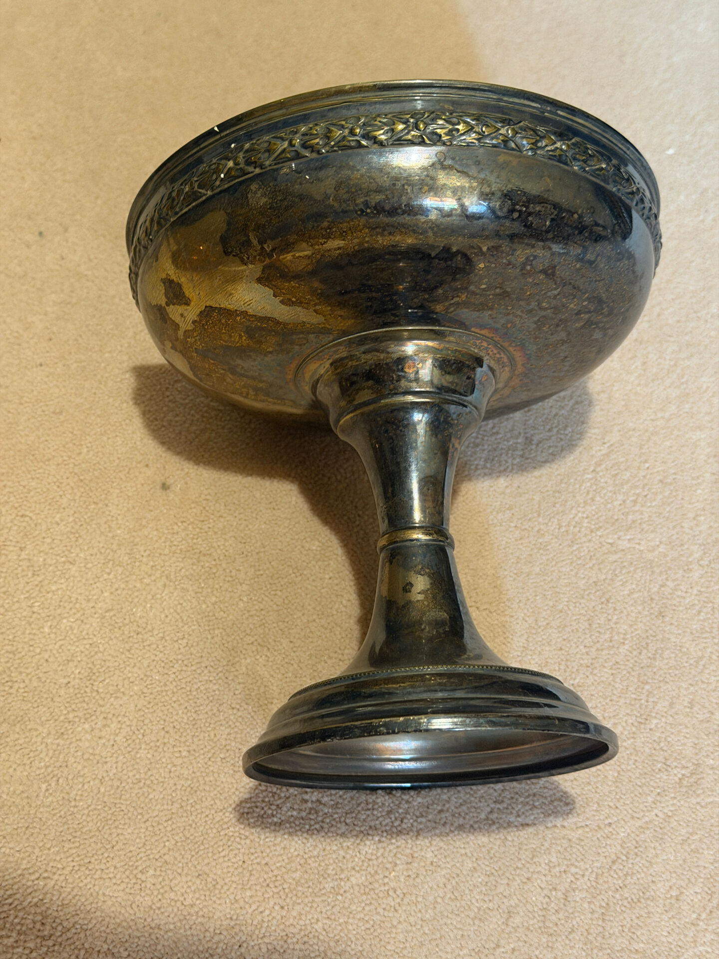 Vintage coupe on a patinated silver-plated metal stand.