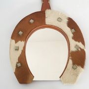 Vintage 1970s cowhide horseshoe mirror