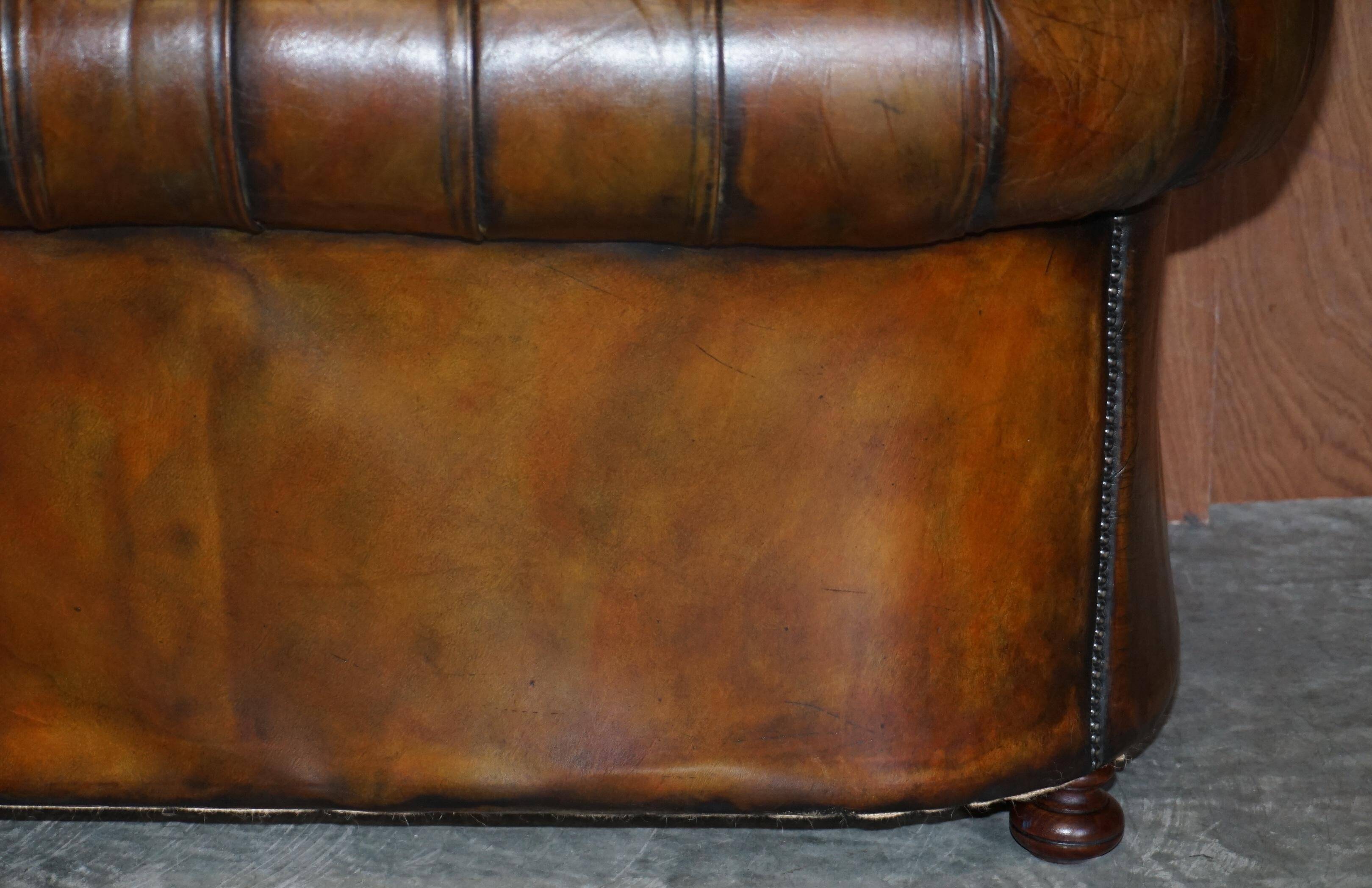 Restored leather Chesterfield sofa, walnut legs.