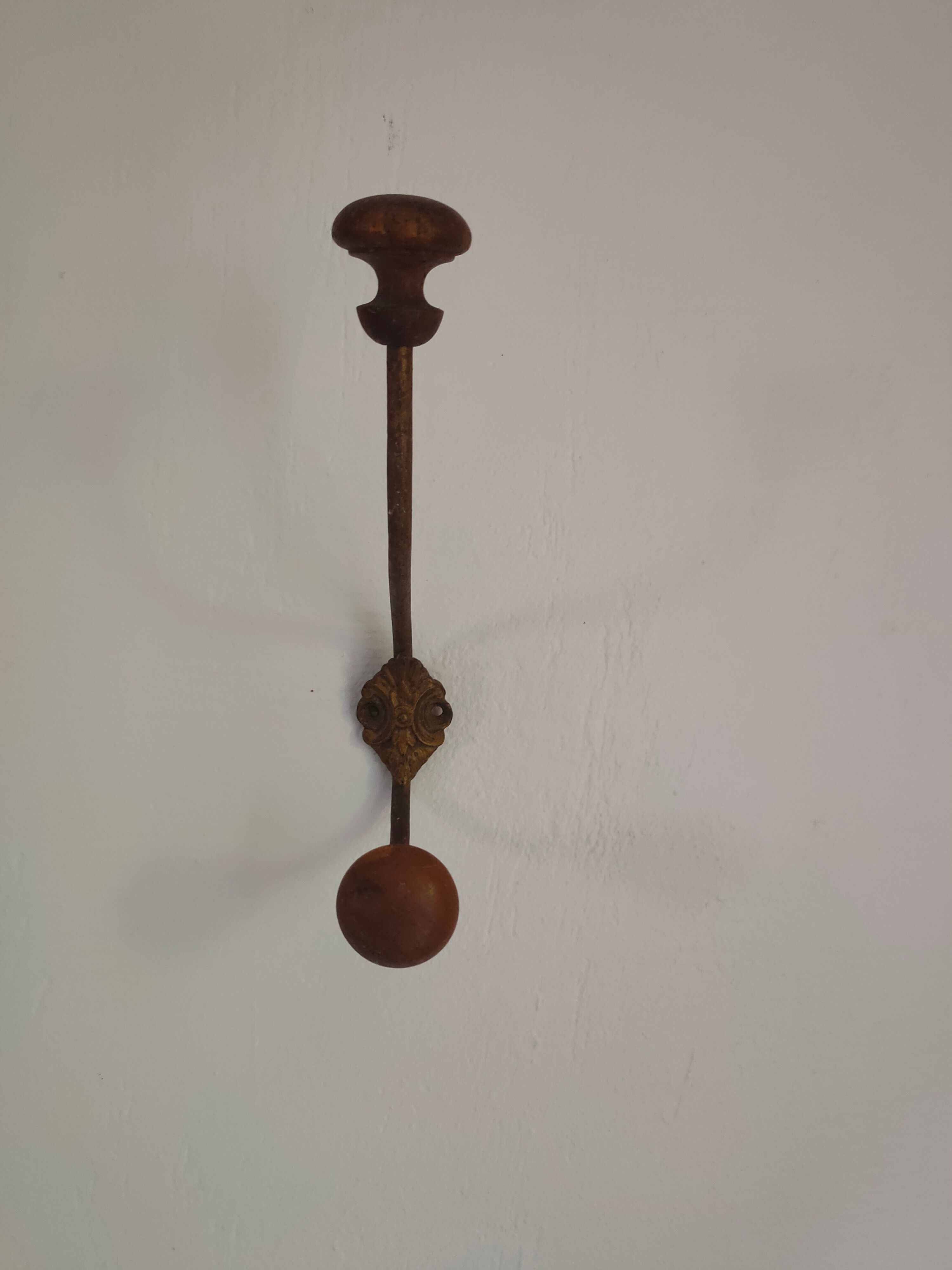 Wooden and metal wall coat rack.