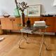 Green and brass trolley on wheels