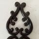 Antique wall candle holder in enamelled cast iron