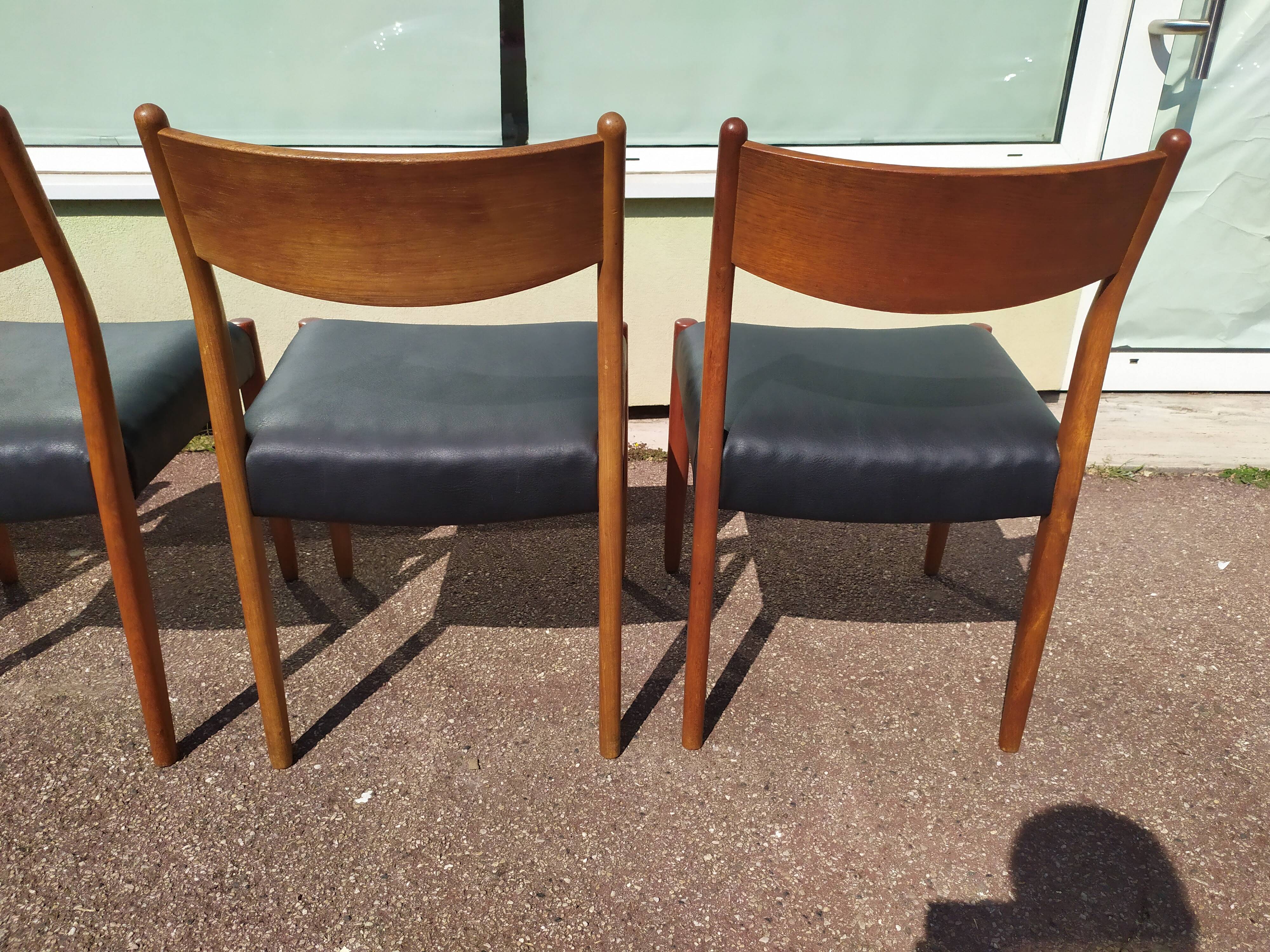 Set of 4 Scandinavian teak chairs in black leather