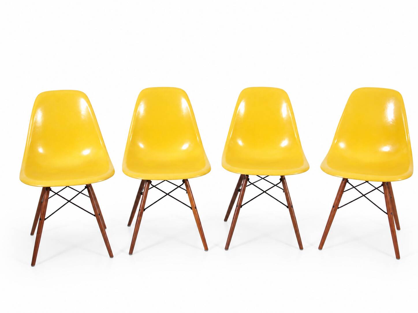 Set of 4 DSW chairs by Charles Eames - yellow fibreglass edition by Herman.