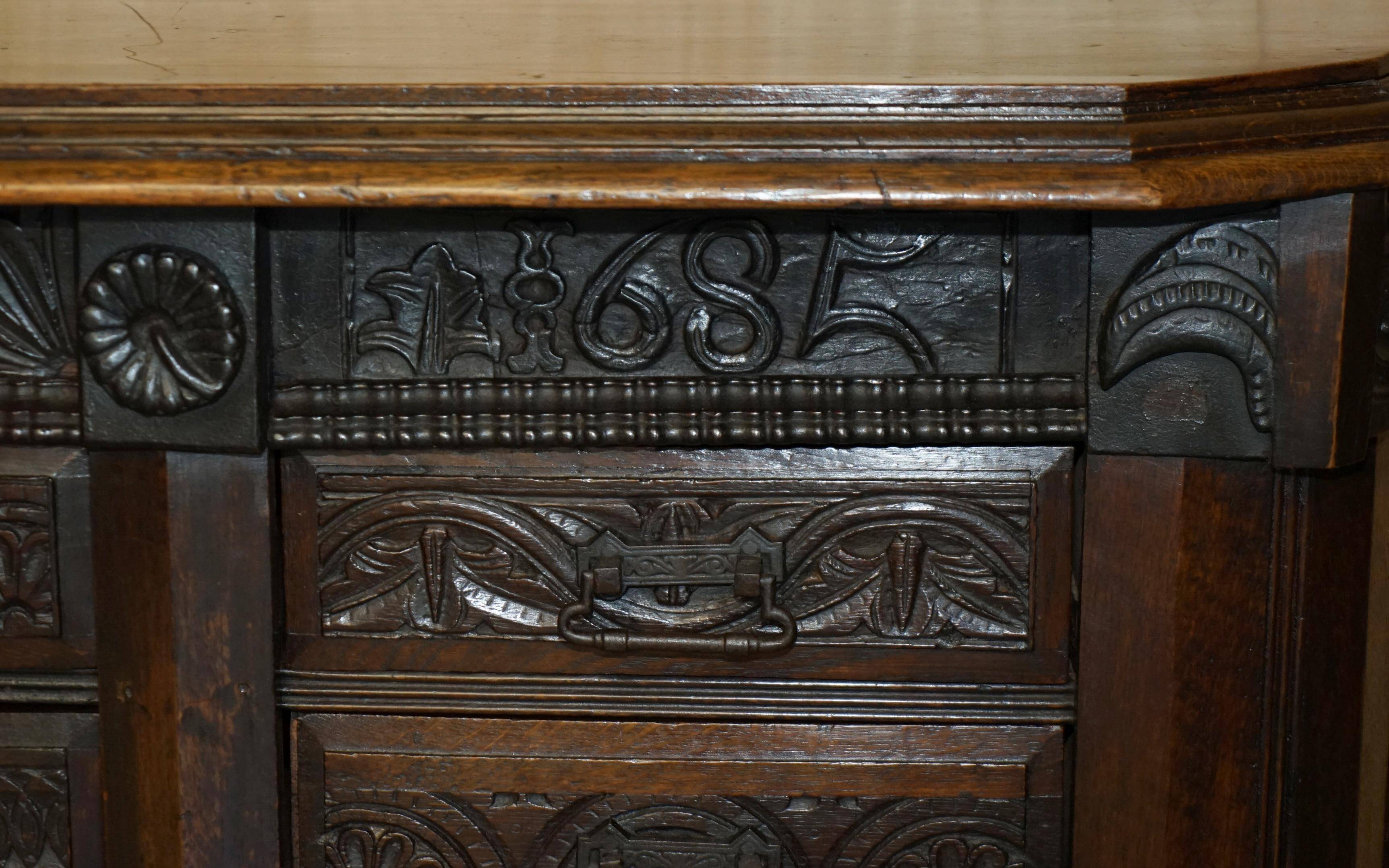 Hand-carved commode from 1685 with sideboards and side cupboards.