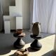 Small low circular four-legged stool in organic old teak with cut-out design H2