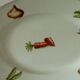 Oval dish in pâte and Limoges enamel decorated with four seasons vegetables.
