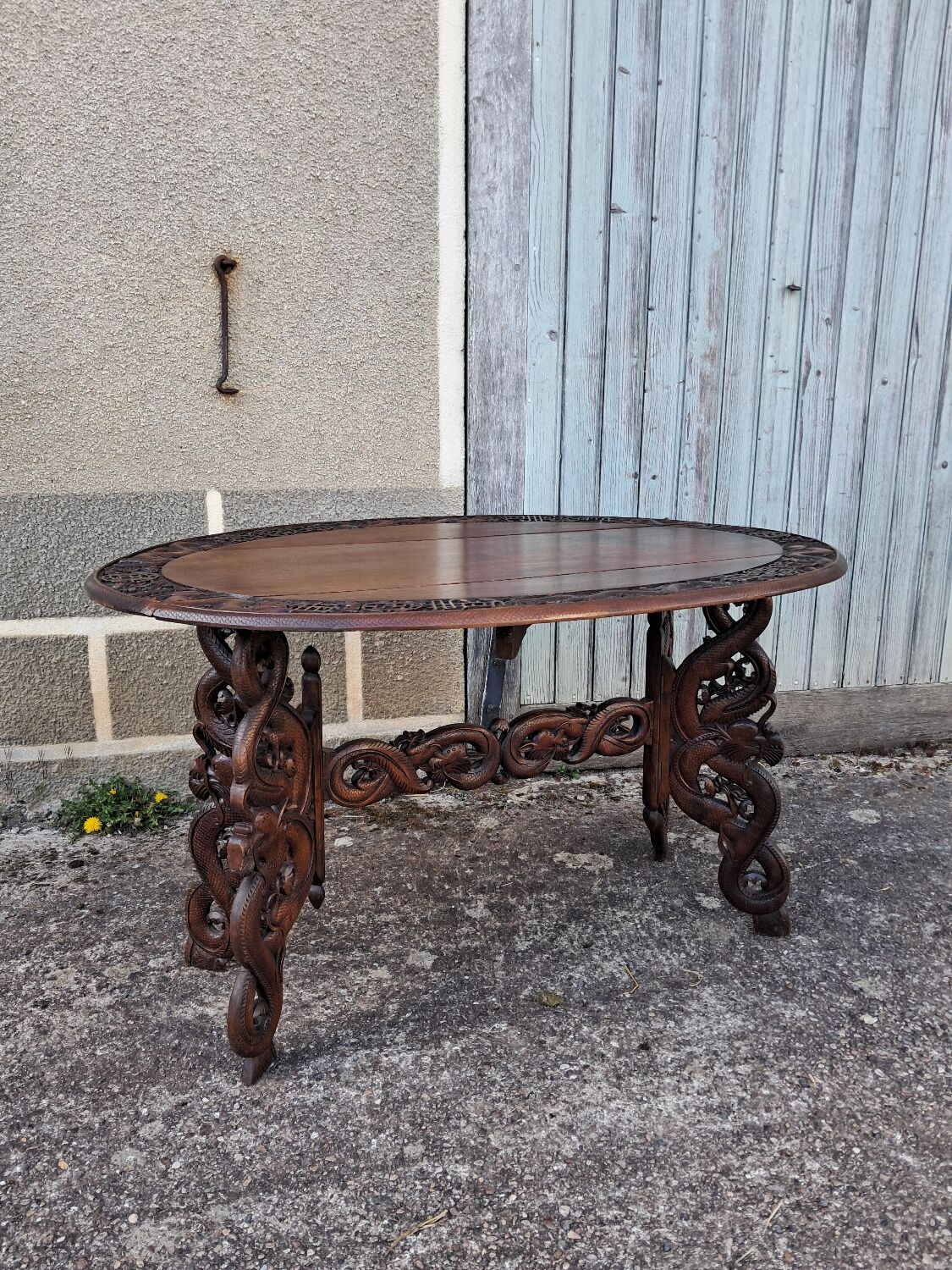 Asian table, mid-height, made of exotic wood.