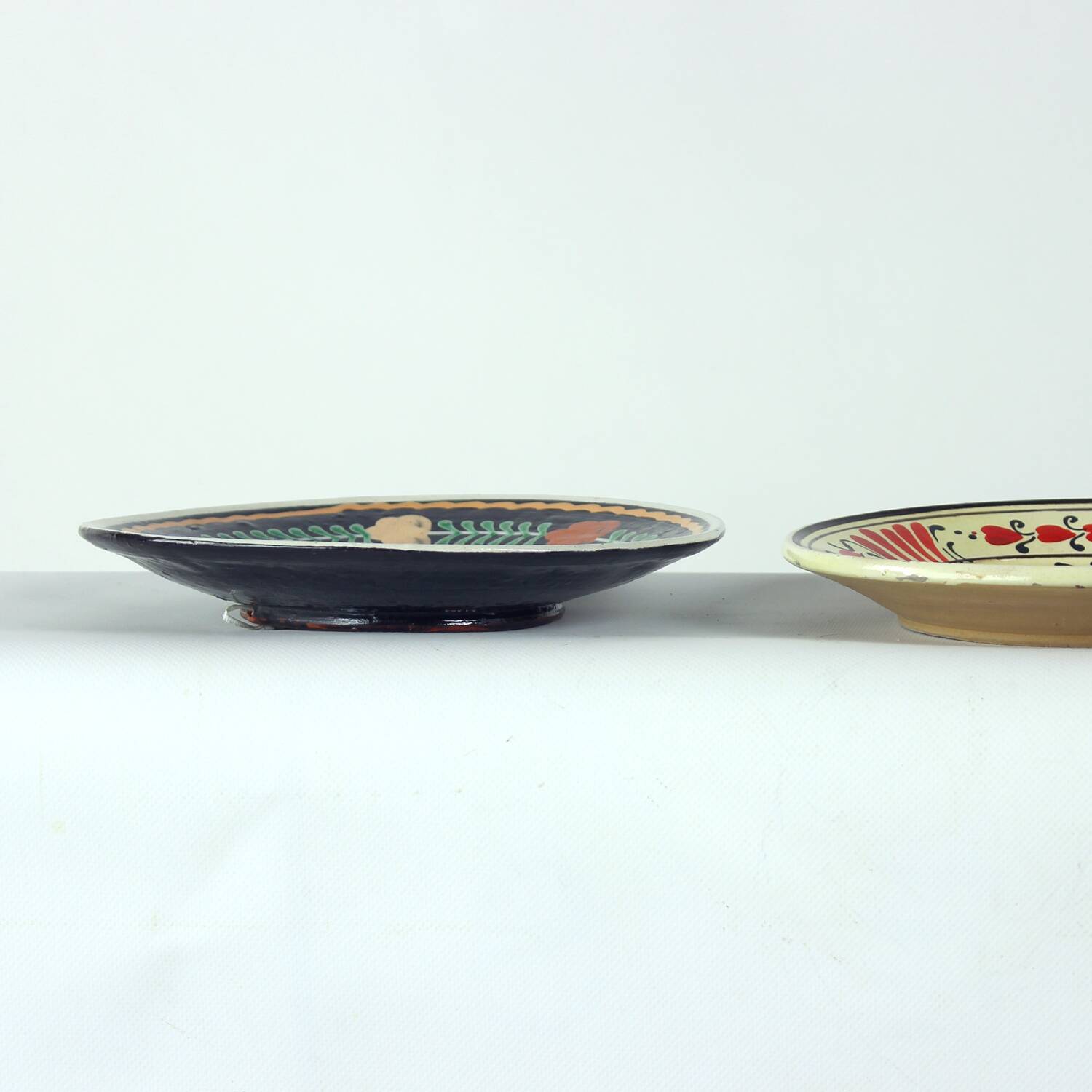 Set of three vintage folk art ceramic wall plates, Czechoslovakia and Romania.