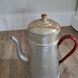 Old enamelled coffee maker in red handle aluminum