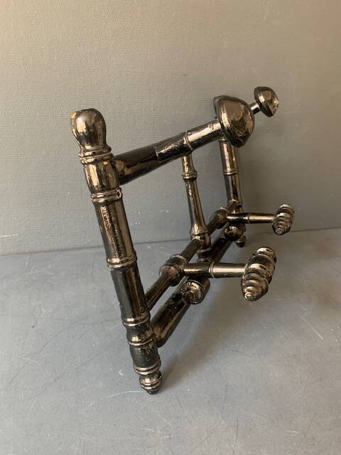 Wall-mounted coat rack in wood 1900