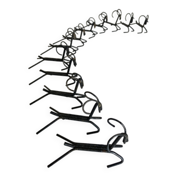 Set of 12 raw iron knife rests 1970