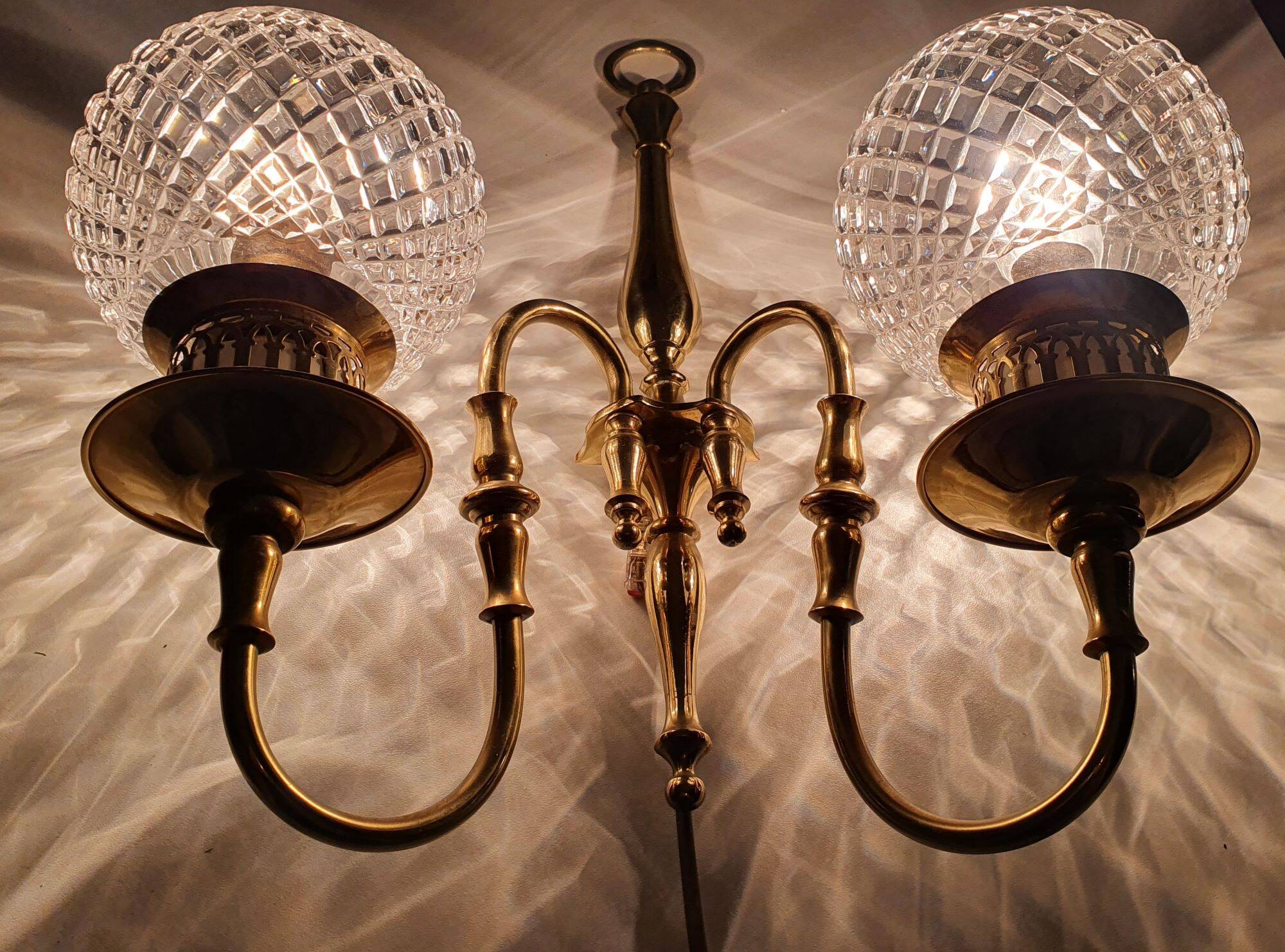 Two-light wall light gold with antique crystal globes