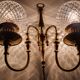 Two-light wall light gold with antique crystal globes