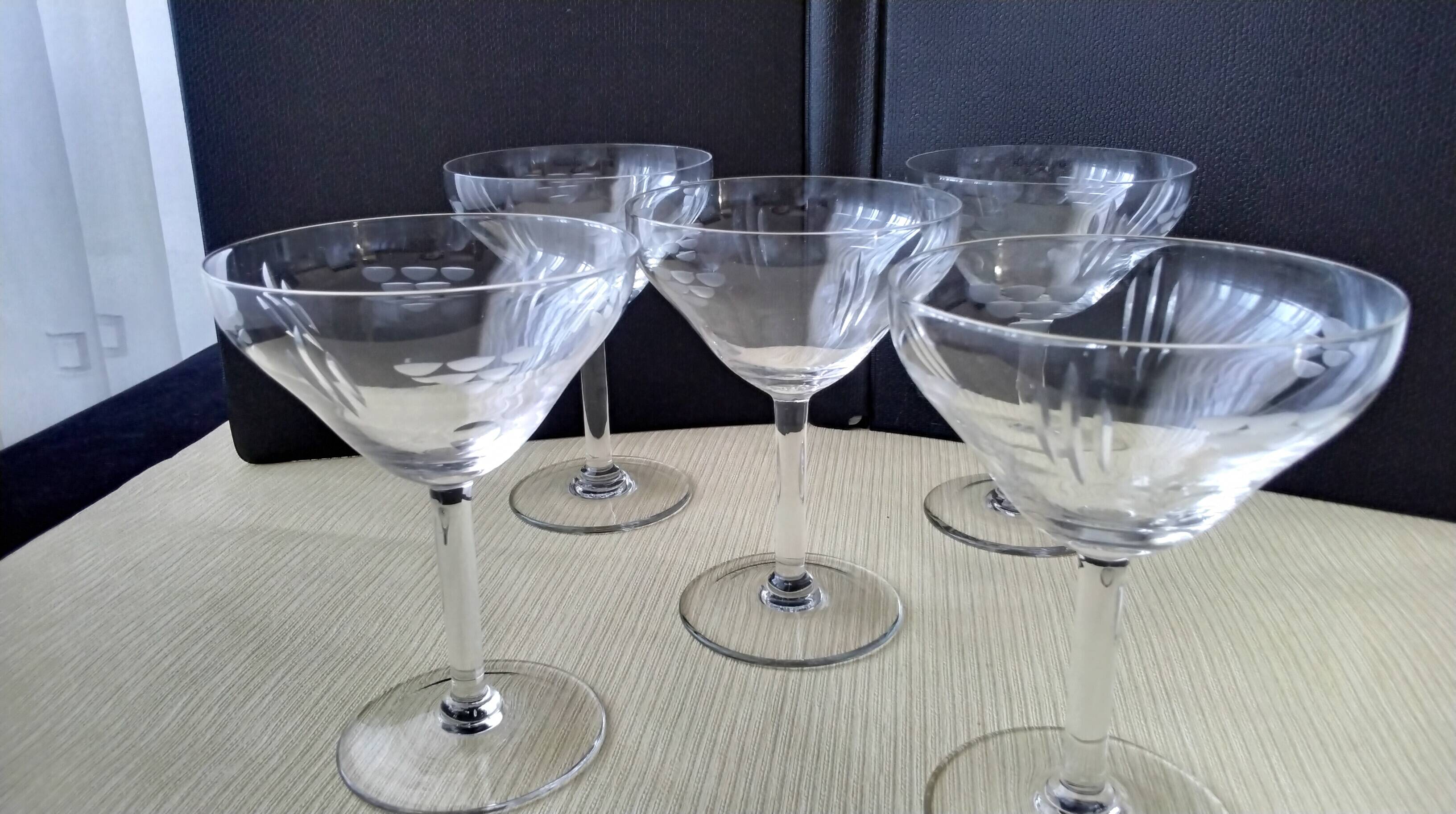 5 Vintage glass champagne coupes with engraved decoration