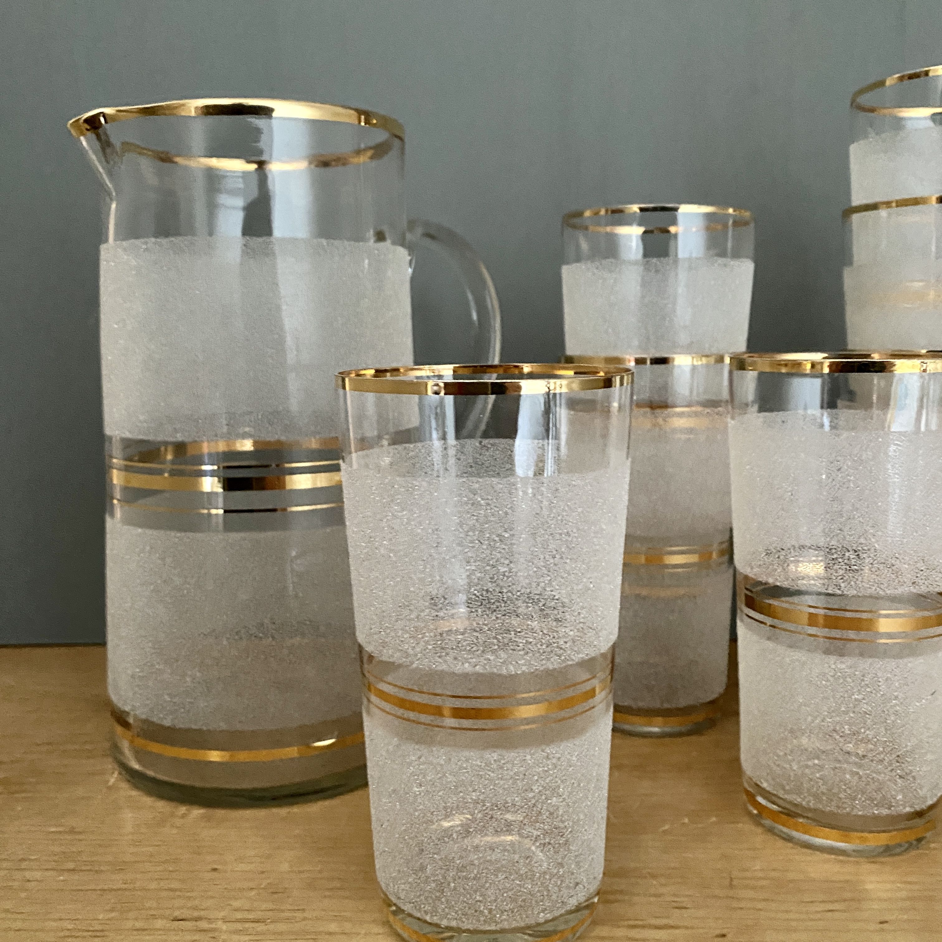 Vintage orangeade service in white granite glass and golden edging