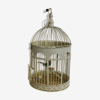 Bird cage transformed into a white metal lamp