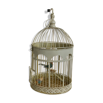 Bird cage transformed into a white metal lamp