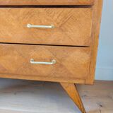 Vintage chest of drawers with checkerboard and compass feet