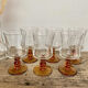 6 small amber-stemmed glasses
