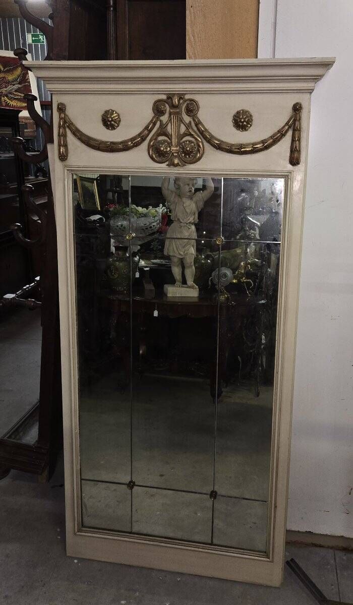 Louis XVI style trumeau mirror with a painted wooden frame.