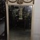 Louis XVI style trumeau mirror with a painted wooden frame.