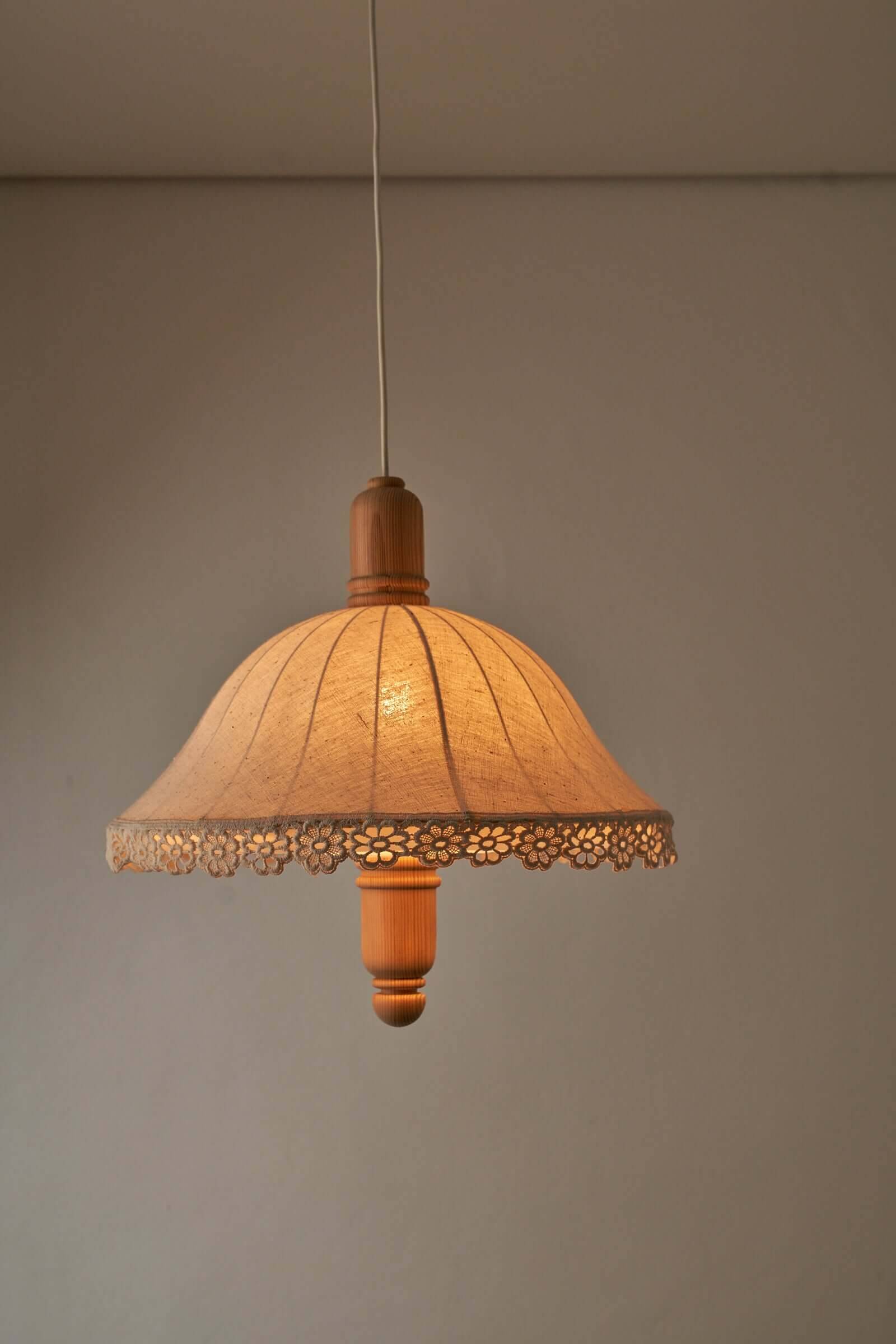 Wood and textile pendant from Sweden