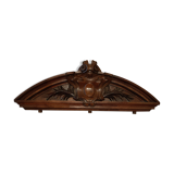 old pediment in carved walnut