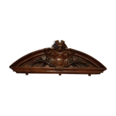 old pediment in carved walnut