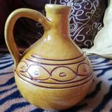 Glazed ocher round pitcher with handle