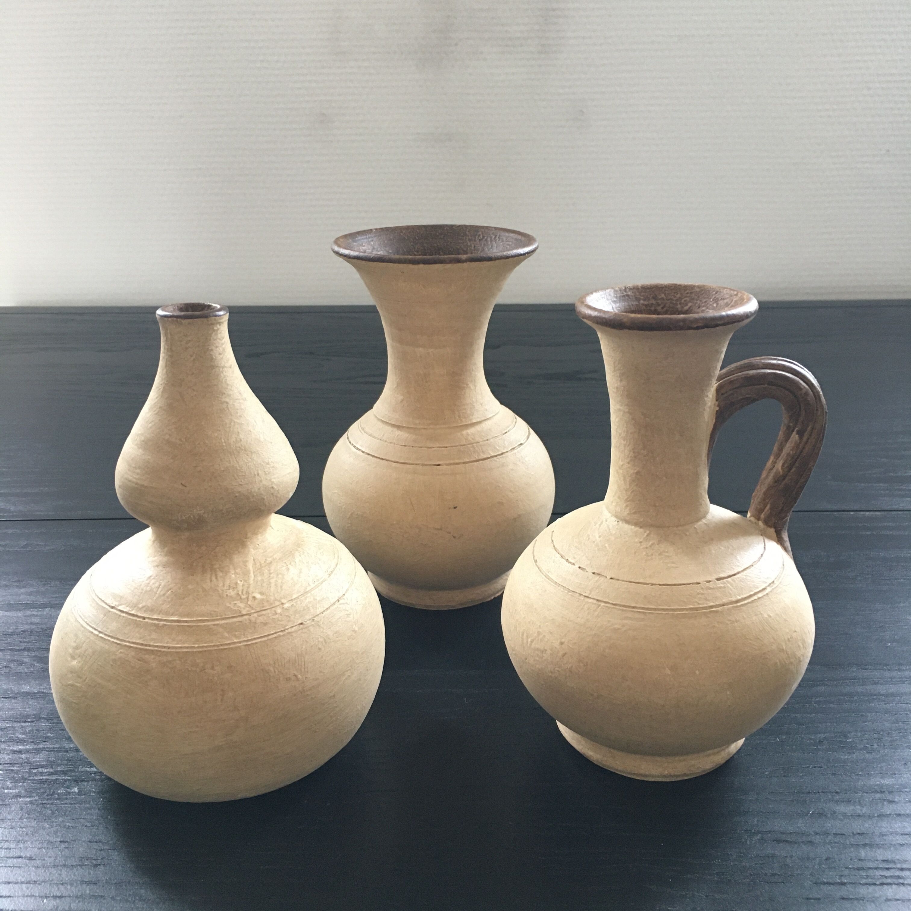 Trio of terracotta vases