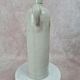 Antique beige glazed stoneware bottle from the 19th century, with a handle, vintage decor.