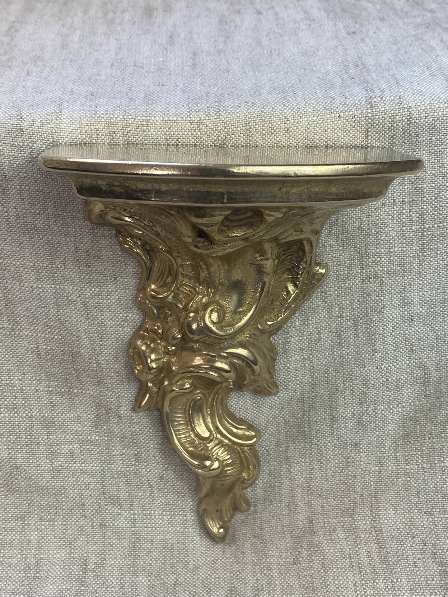 Small wall console in Rococo style in bronze