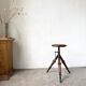 Tripod workshop stool in turned wood and cast iron — circa 1900