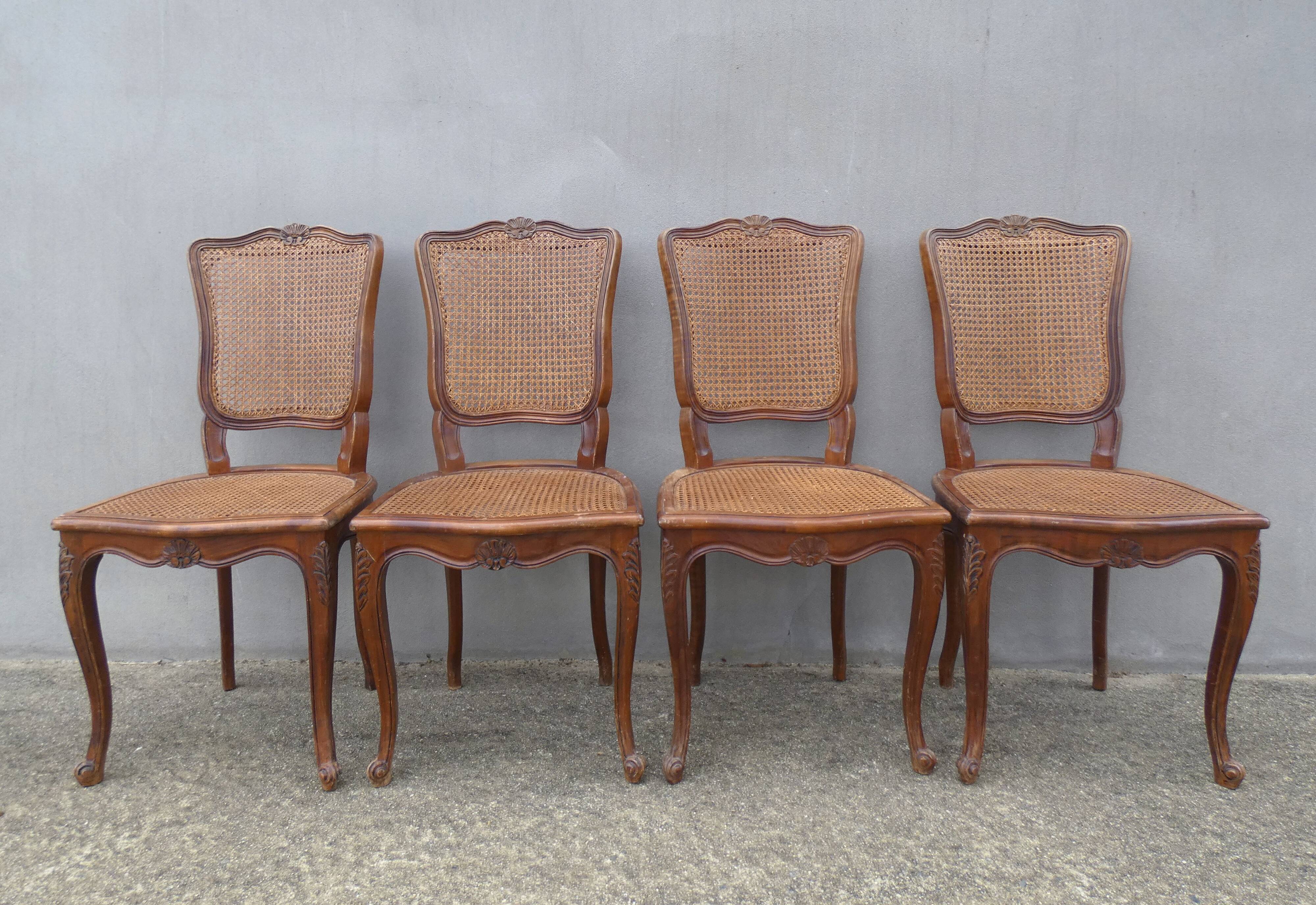 4 caned wooden chairs