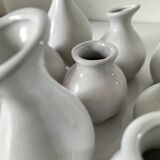 Multiple vintage white soliflore – centrepiece with 9 ceramic vases